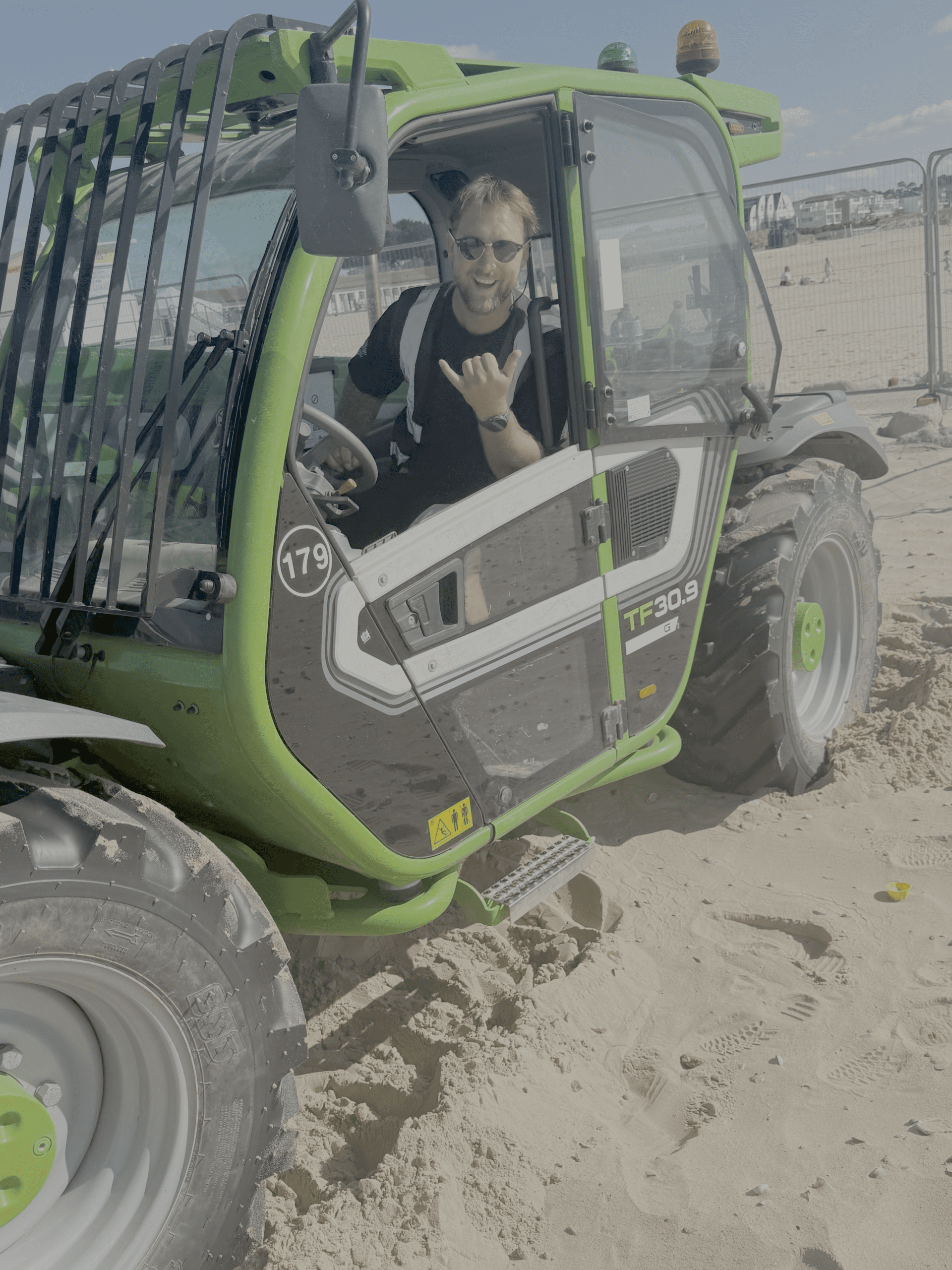 Got Hustle Event Crewing A smiley member of the Got Hustle Event Staff Team in a Telehandler